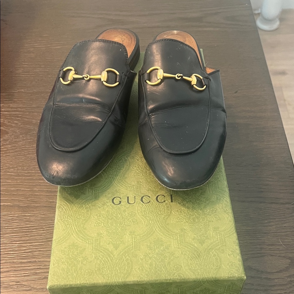 Gucci Black Leather Mules with Gold Accents